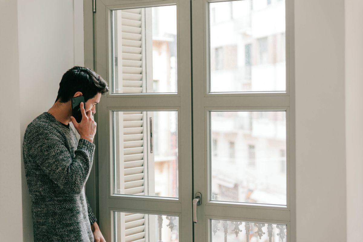 A man deciding whether or not to replace his windows.